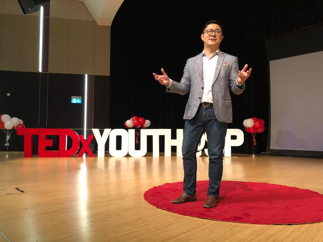 Eugene Seah delivering a TEDx talk