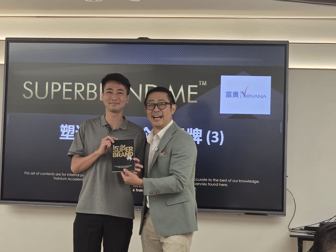 Eugene Seah presenting his Superbrand Me book at a corporate session
